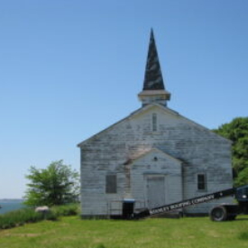 PT-3d.+Chapel+entrance+view_damaged+windows,+faded+paint+(2013)